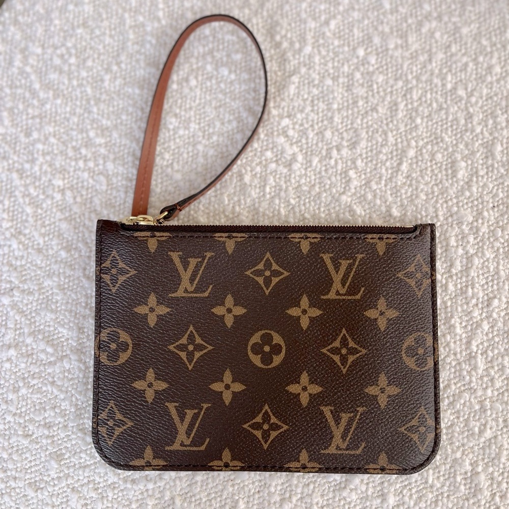 Genuine LOUIS VUITTON NEW monogram wristlet.